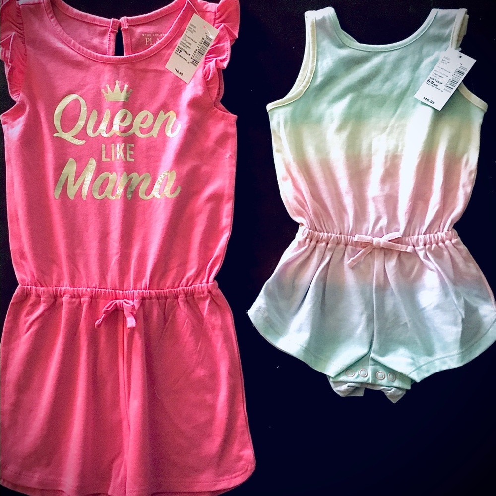Two rompers brand new with tags on them.